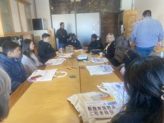 A group exchanging ideas around a table.