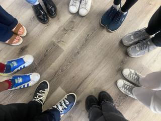 A circle of participants’ shoes.
