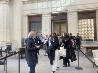 Participants in conversation inside Parliament.