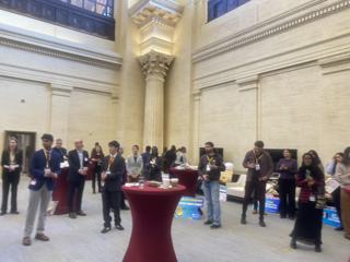 Guests listening to a presentation in the event hall.