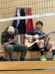 Two participants playing accordion and guitar.
